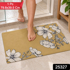 A person's feet are visible on a mustard yellow mat featuring white floral patterns, next to a shower stall.