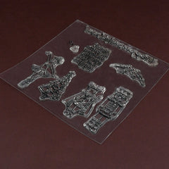 A close-up of the clear silicone stamp sheet, showcasing the detailed designs on a dark brown surface.