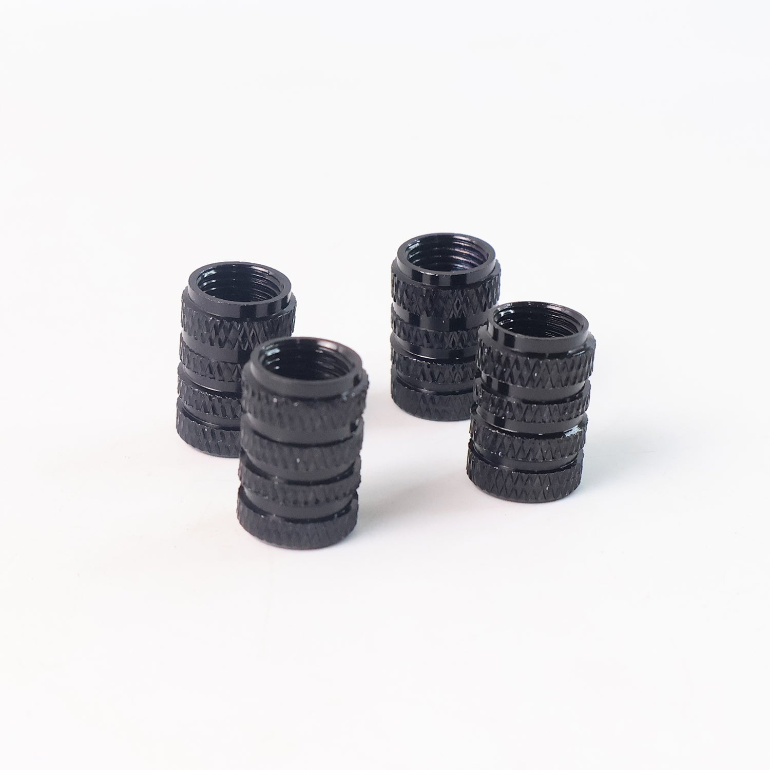 Silver tire valve stem cap on clean background