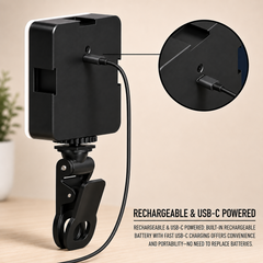 A black LED video light with a white diffuser, attached to a clip, being charged via a USB-C cable.